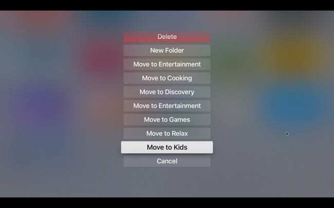 Pindahkan aplikasi ke folder di Apple TV dengan menu