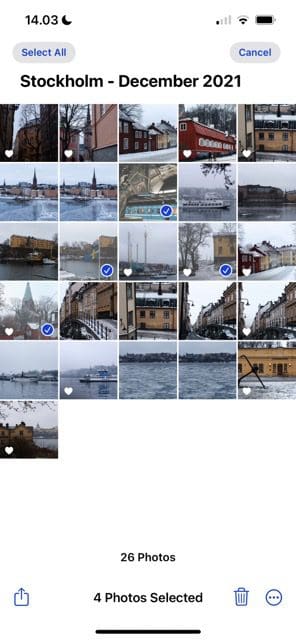 لقطة شاشة توضح كيفية تحديد صور متعددة في نظام iOS
