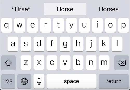 Captura de pantalla de un teclado de iOS que muestra tres predicciones de autocorrección: " Hrse", Horse y Horses