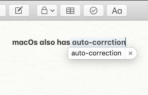 Captură de ecran a unui balon de predicție pentru corectare automată pe macOS