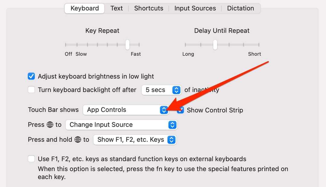 لقطة شاشة تعرض إعدادات شريط اللمس على جهاز Mac