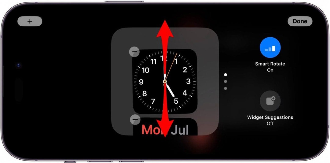 iPhone-Standby-Widgets-Bildschirm mit roten Pfeilen, die auf dem Widget-Stapel nach oben und unten zeigen und anzeigen, dass Sie nach oben oder unten wischen müssen
