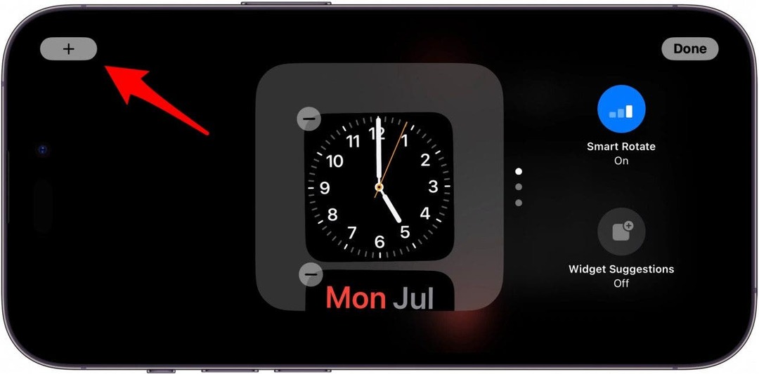 iPhone-Standby-Widgets-Bildschirm mit einem roten Pfeil, der auf das Plus-Symbol zeigt
