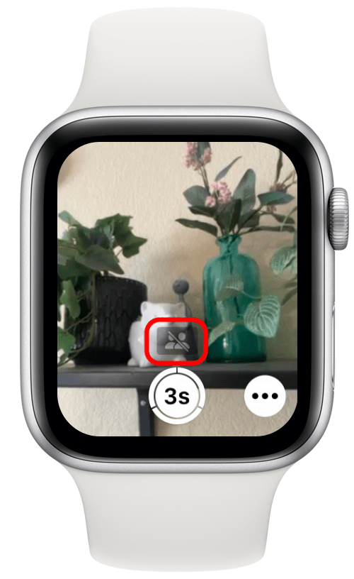 Screenshot van het scherm van de Apple Watch-camera-app met het pictogram van de gedeelde bibliotheek, donker gemaakt met een schuine streep erdoorheen
