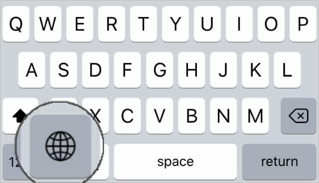Selektor klávesnice ikony zeměkoule na klávesnici iPhone