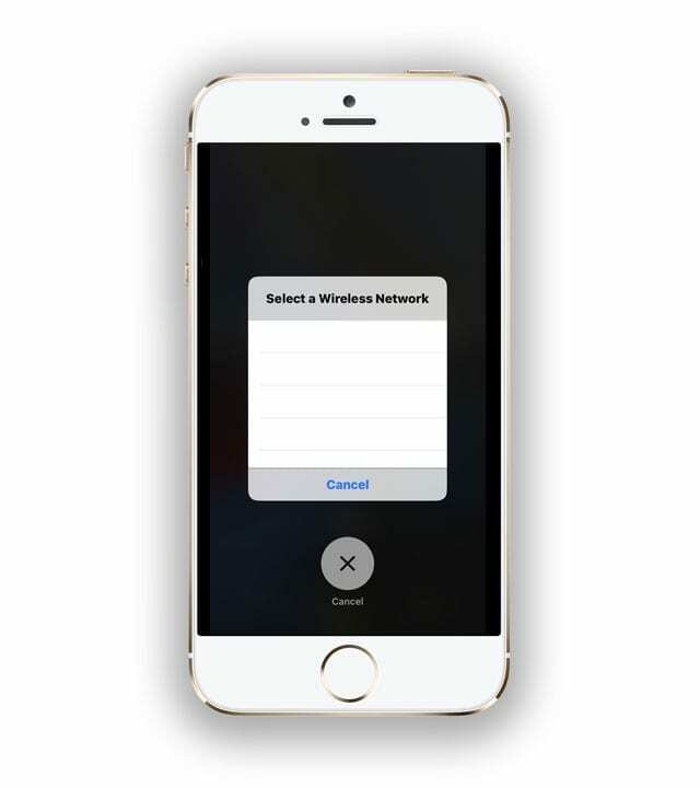 starší iPhone přilepený na výběr bezdrátové sítě na prázdné obrazovce